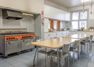 Kitchen equipped with commercial gas stove and oven