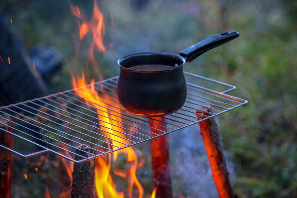 prepare hot drinks over fire