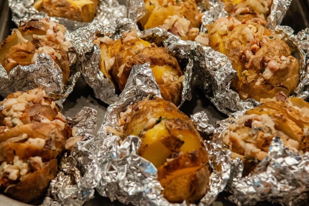 roasted potatoes are simple to make over campfire